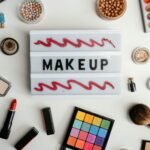 Stylish flat lay of various makeup products beautifully arranged around a makeup sign, perfect for beauty concepts.